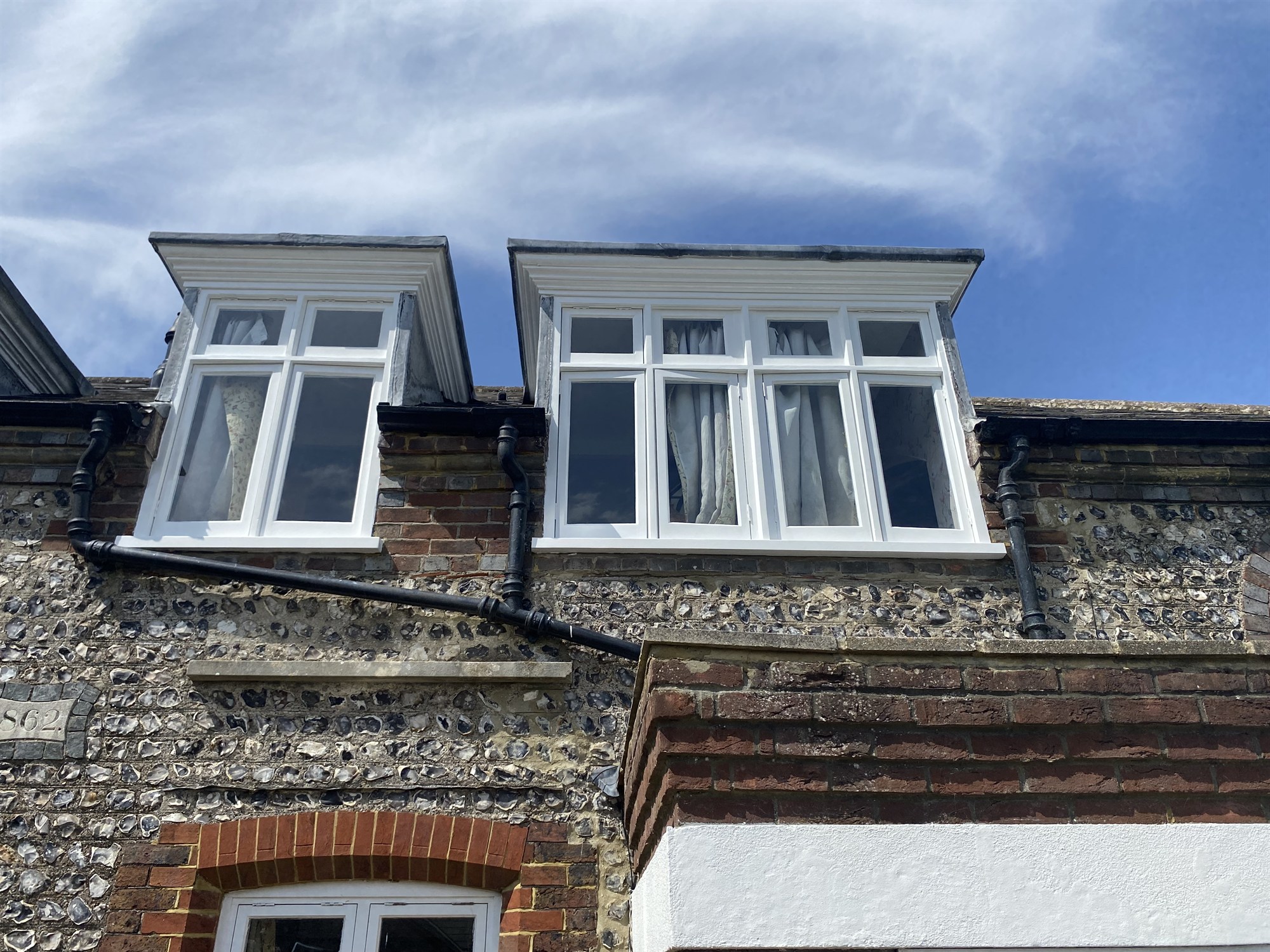 Restored white sash windows on a Brighton period property